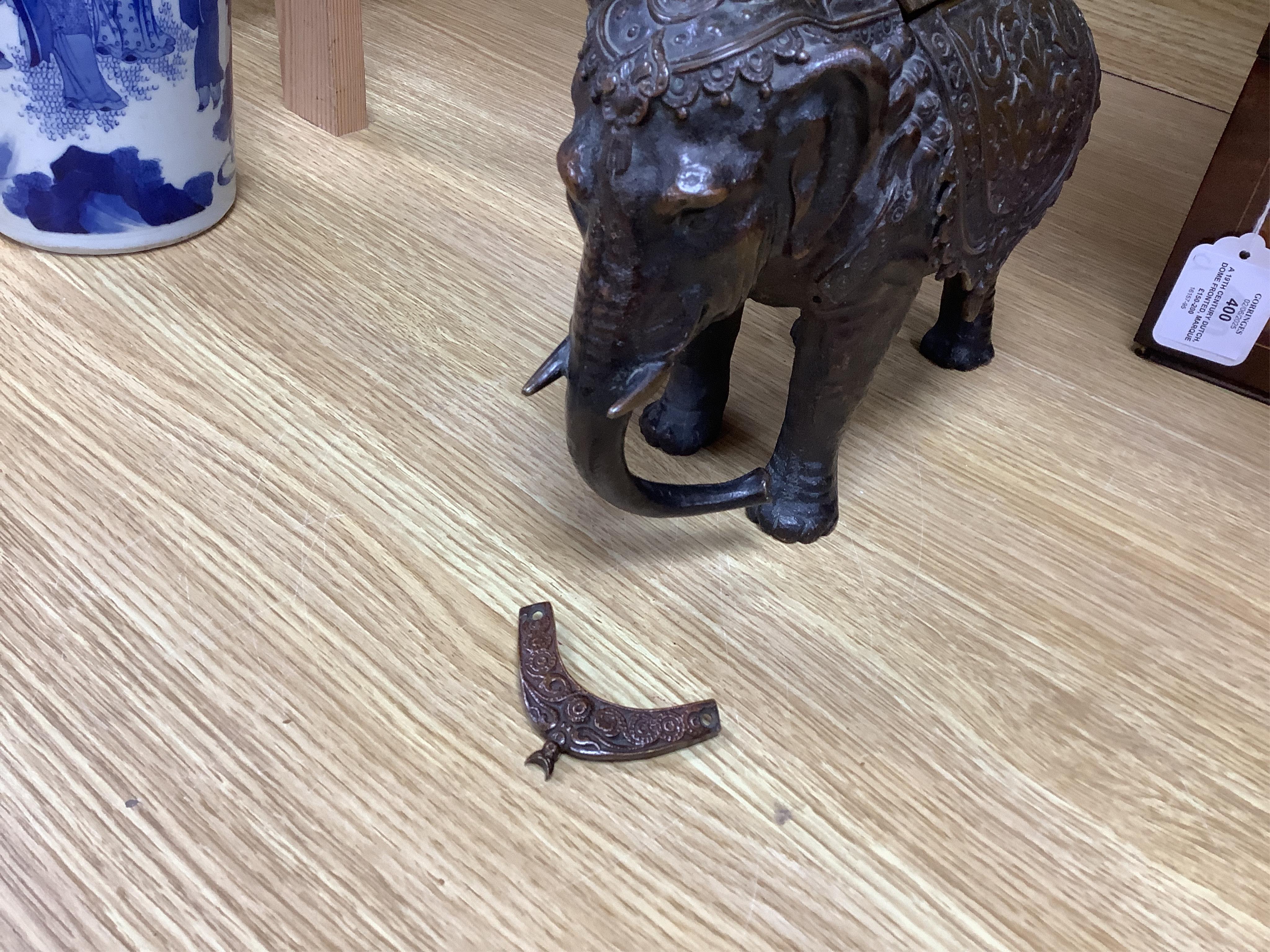 A novelty late 19th/early 20th century bronze inkwell in the form of an Indian elephant, 27cm wide